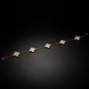 Gold clover station bracelet with white mother of pearl style charms