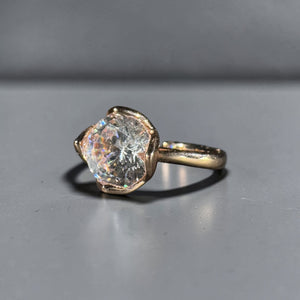 Shop the Lumière Solitaire Adjustable Ring featuring a brilliant round zircon statement design in gold and silver stainless steel finishes. Elegant minimalist luxury jewellery for women.