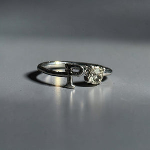 Silver stainless steel adjustable alphabet letter zircon designer ring for women Aura Collection