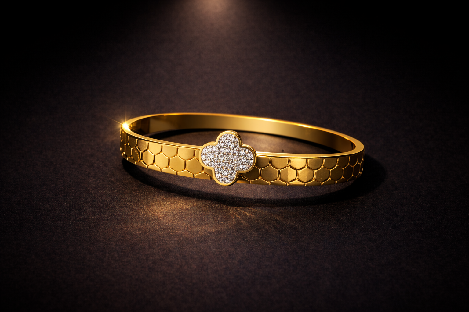 Gold honeycomb textured bangle with crystal clover centerpiece luxury designer bracelet for women