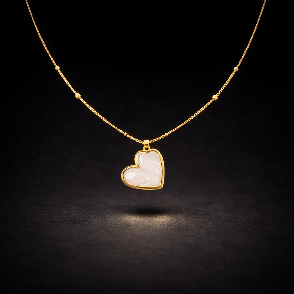 Gold heart pendant necklace with white mother of pearl inlay