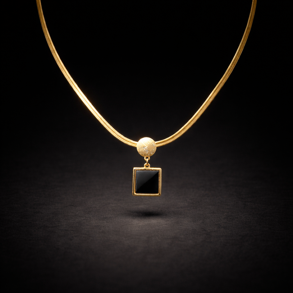 Gold snake chain necklace with black square pendant