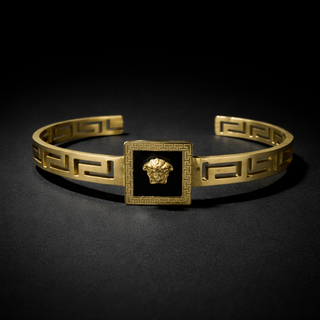 Gold Greek key open cuff bracelet with black square Medusa center detail luxury designer jewellery