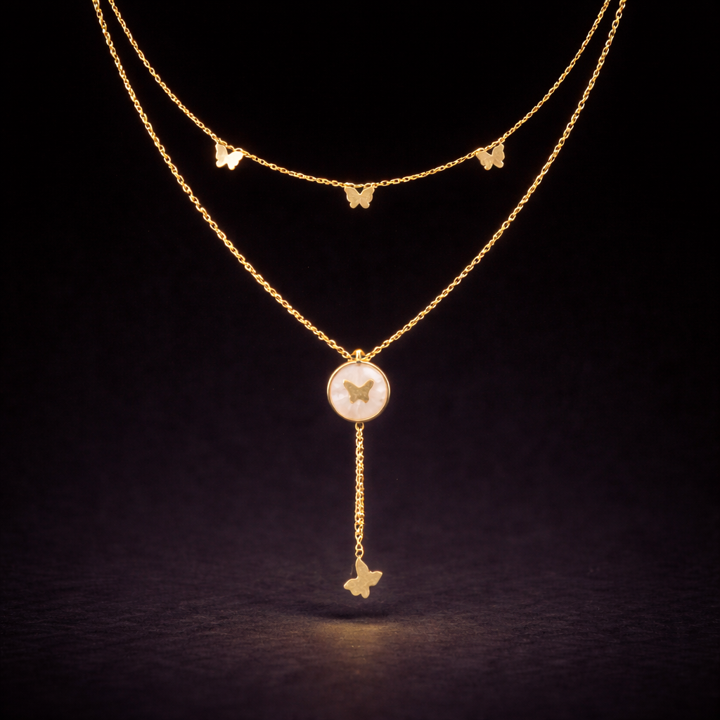 Gold layered butterfly necklace with round mother of pearl pendant and dangling butterfly charm