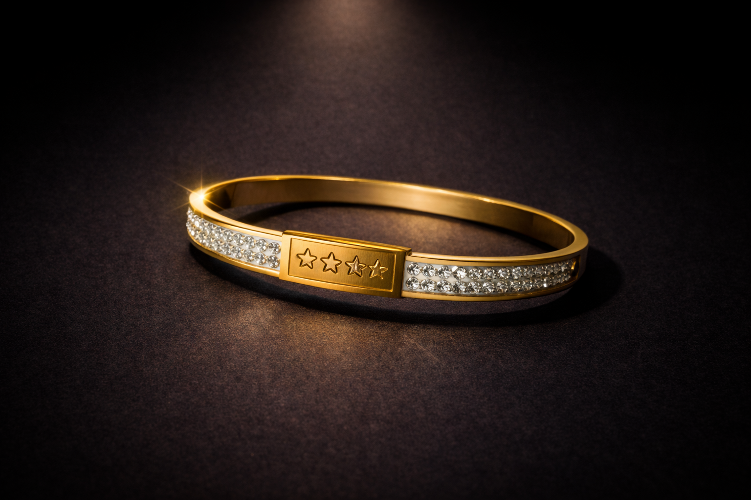 Gold structured bangle with pavé crystal bands and engraved star centerpiece luxury bracelet for women