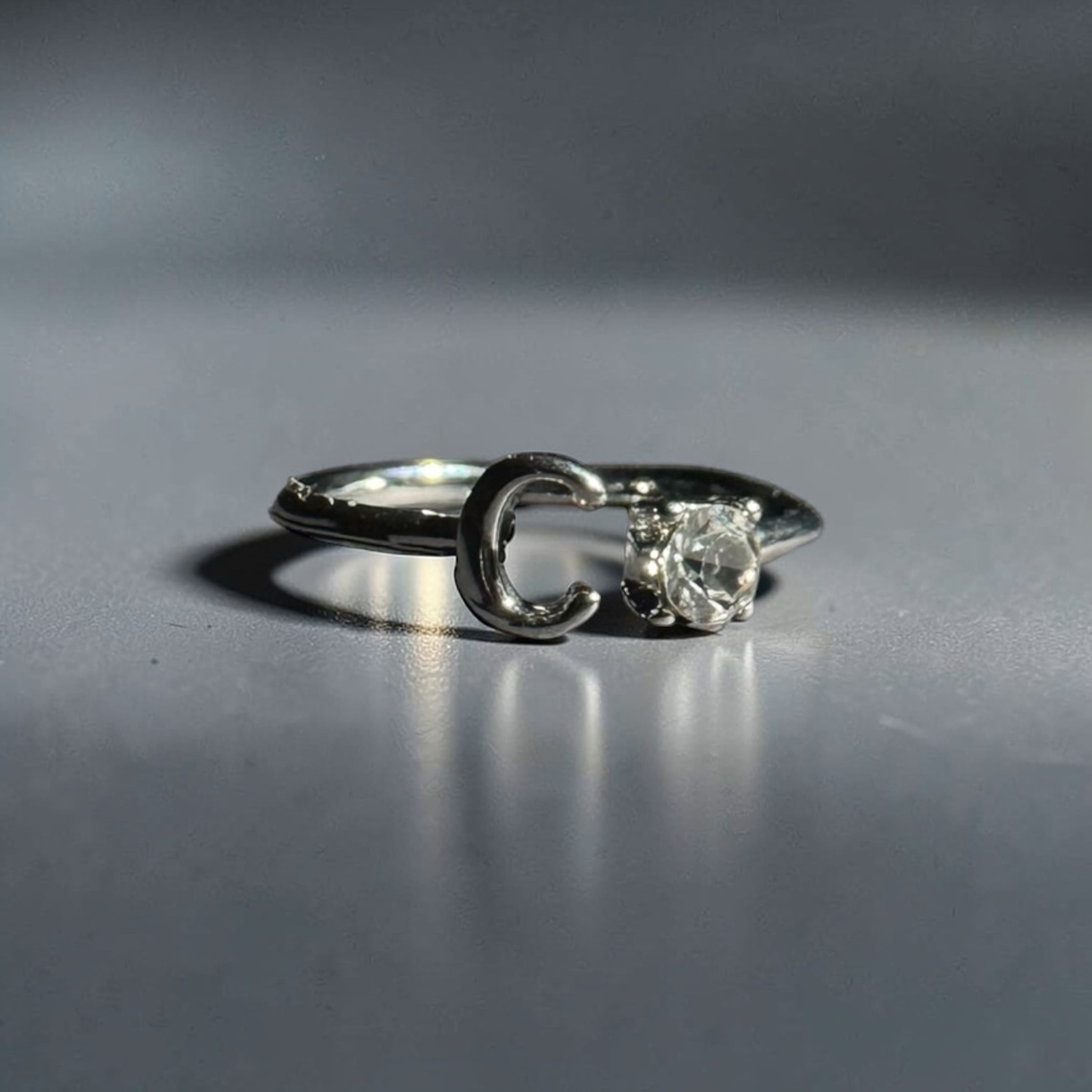 Silver stainless steel adjustable alphabet letter zircon designer ring for women Aura Collection
