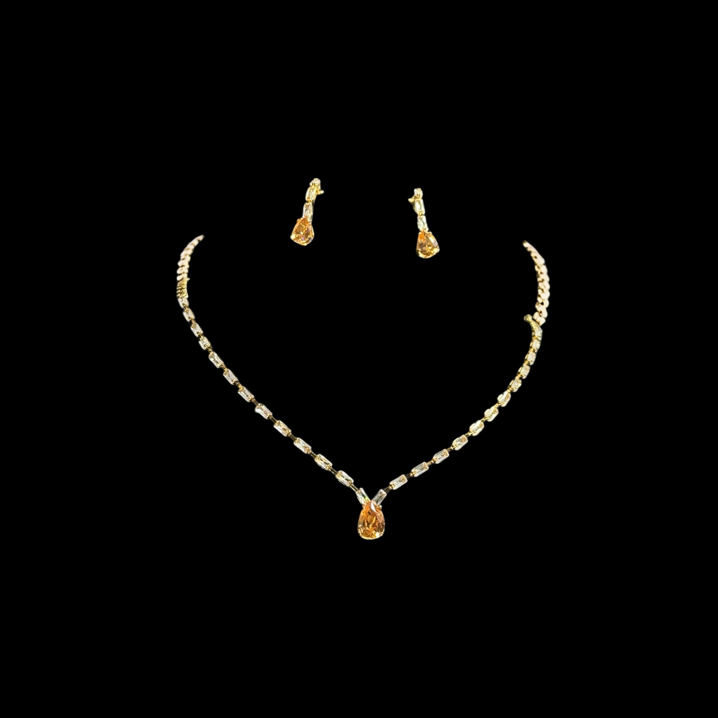 Gold crystal necklace and earrings set with champagne teardrop pendant