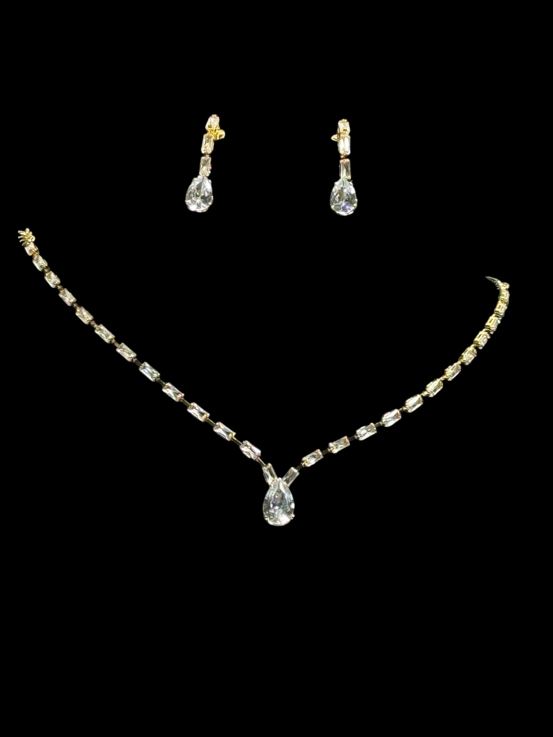 Gold crystal necklace and earrings set with clear crystal teardrop pendant